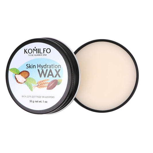 Komilfo Skin Hydration Wax (30g) in a black tin container, showing the solid wax and ingredients like shea butter and almond.